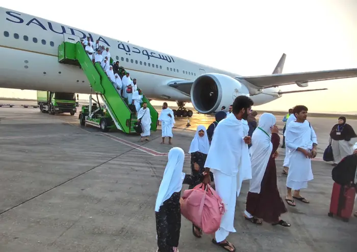 Pilgrims boarding a Saudia flight
